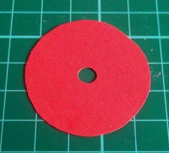 red paper disc with hole