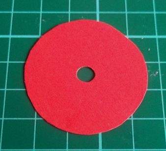 red paper disc with hole
